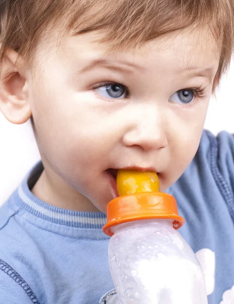 Stock image Little baby boy drinking milk, close up