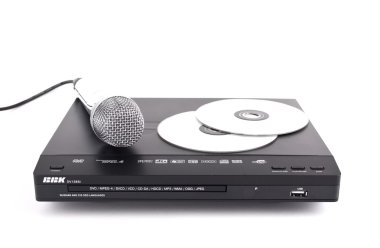 Dvd player, disks and microphone isolated clipart