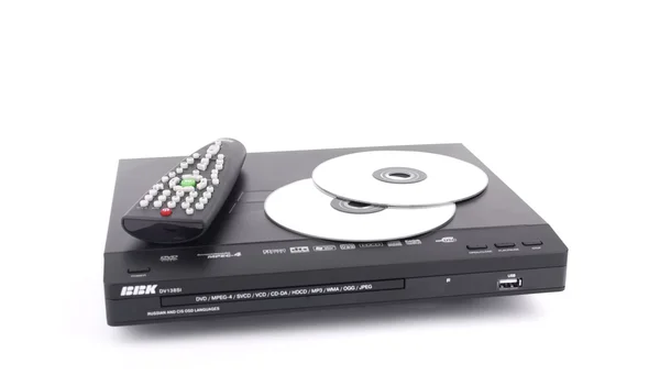 stock image Black dvd-player with remote control and discs