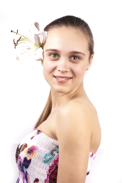 Joven feliz hermosa chica con una flor aislada —  Fotos de Stock