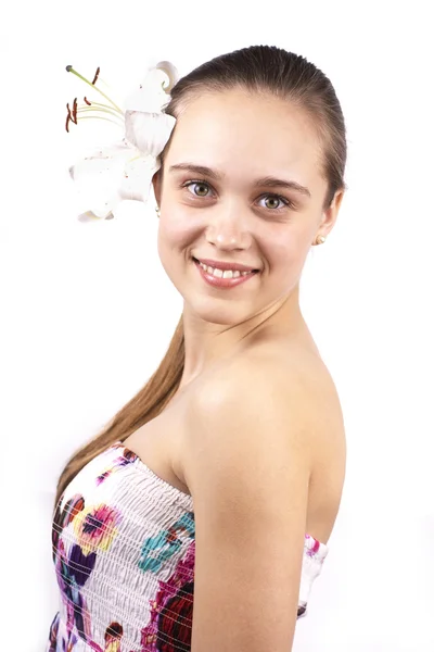 Jonge gelukkig mooi meisje met een bloem geïsoleerd — Stockfoto