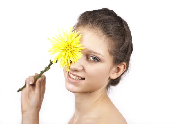 Portrait of young attractive woman with yellow flower isolated — Stock Photo, Image
