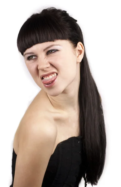 Portrait of expressive woman with her tongue out — Stock Photo, Image