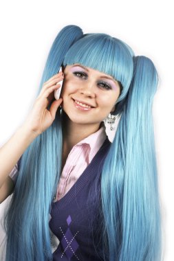 Cute smiling woman with blue hair talking on mobile phone