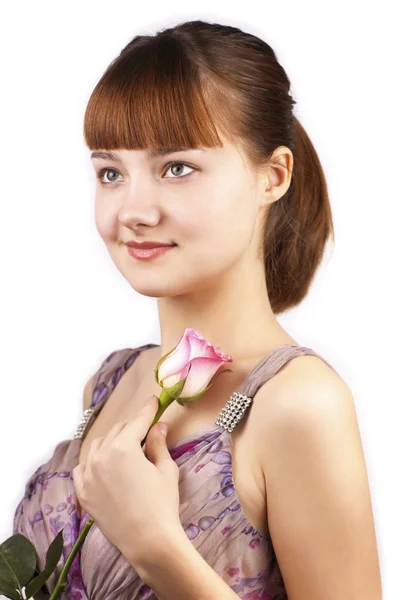 Portrait of young smiling woman with pink rose — Stock Photo, Image