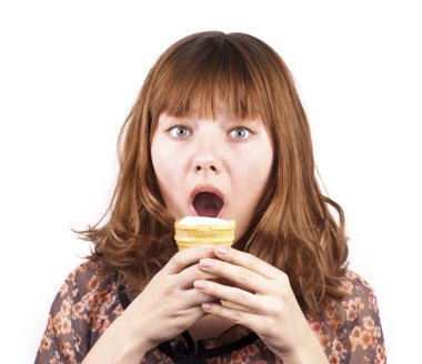 Portrait of funny expressive girl eating ice-cream isolated clipart