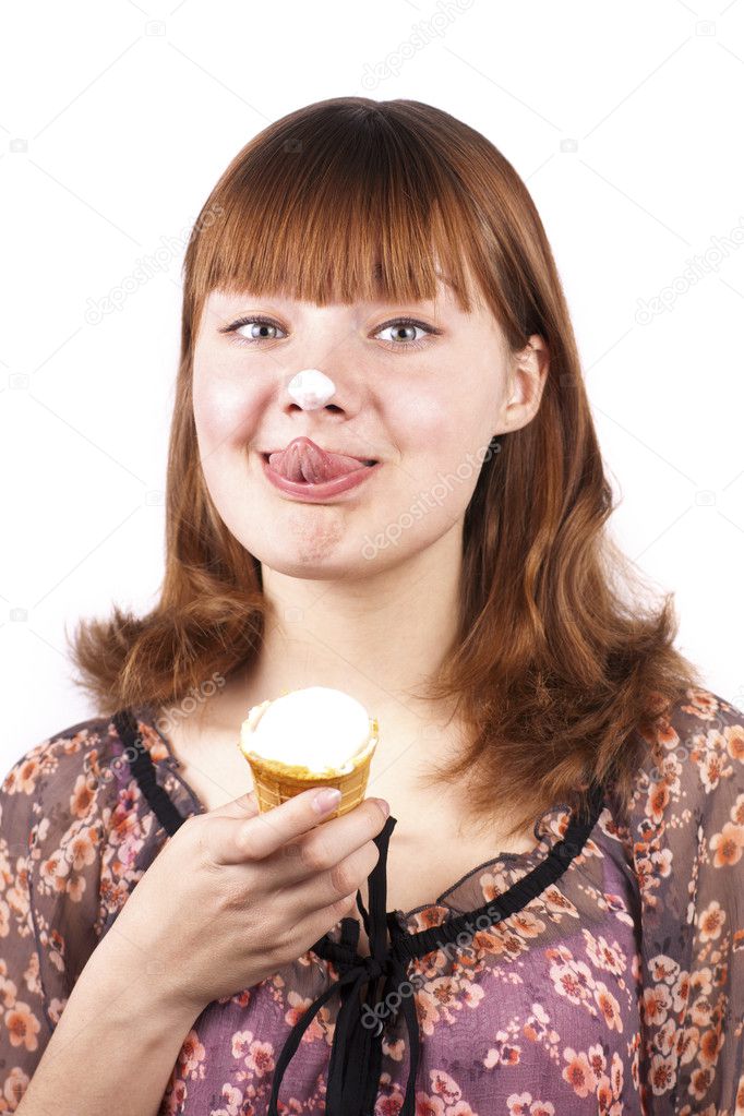 Portrait of funny expression girl eating ice-cream isolated