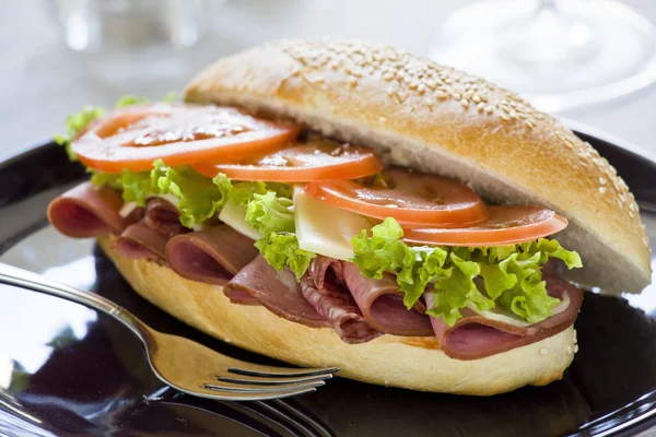 Sandwich On A Black Plate — Stock Photo, Image