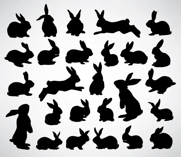 Siluetas de conejo — Vector de stock