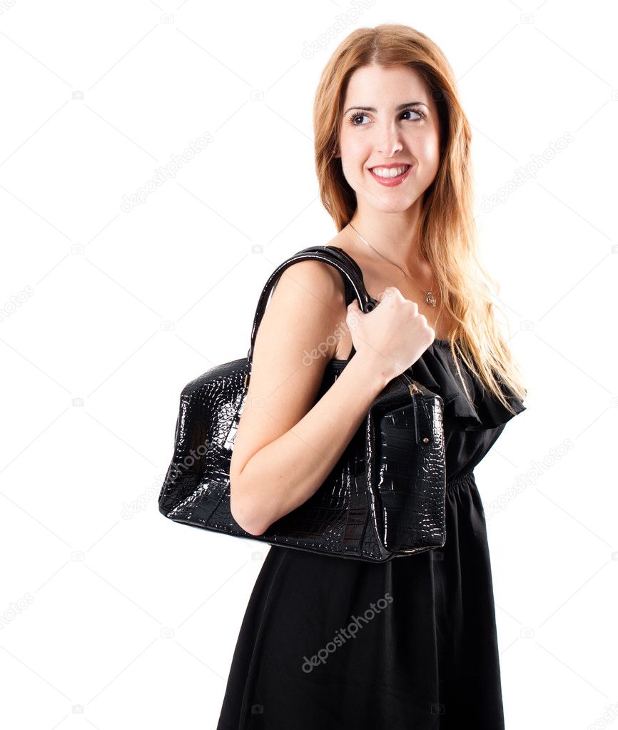 Smiling redhead with handbag