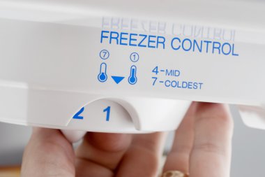 Lowering freezer control clipart