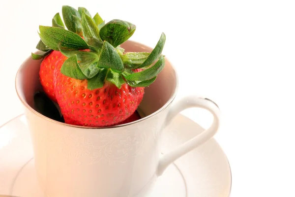 stock image Fresh Red Strawberries inside White Teacup