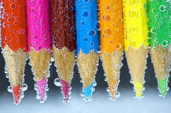 Colorful pencils close-up on black background — Stock Photo, Image