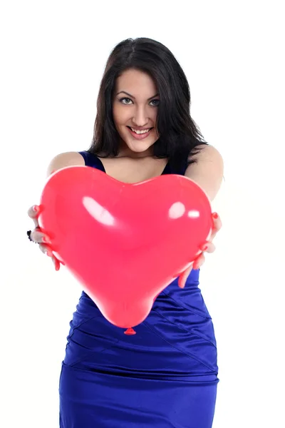 stock image Portrait of a beautiful girl with a red balloon in her hands