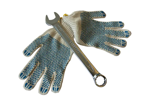 Schraubenschlüssel mit Handschuhen — Stockfoto