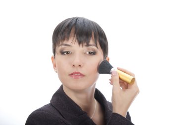 Business woman touching up her make up clipart