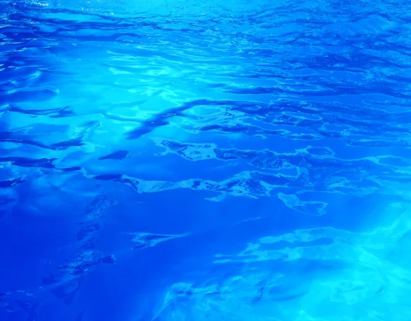 Water blue transparent texture from a swimming pool — Stock Photo, Image