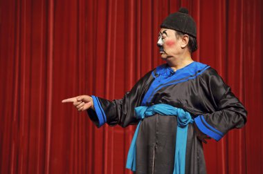 Chinese traditional mime actor performs on stage clipart