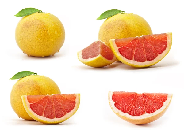 Grapefruit mit Blättern und Tropfen — Stockfoto