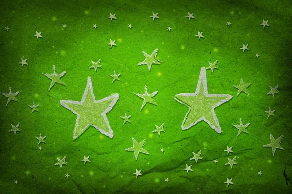 Sterne auf grünem Papier — Stockfoto