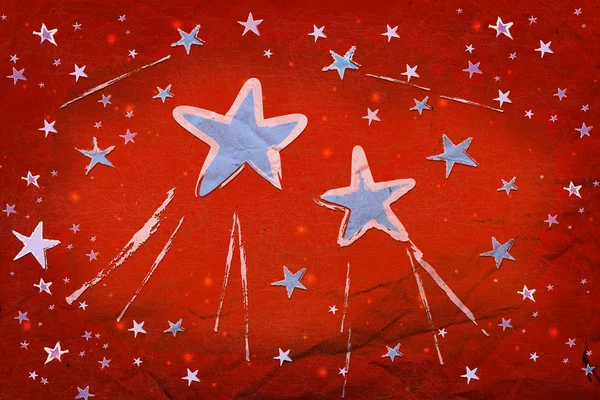 Звезды на красной бумаге — стоковое фото