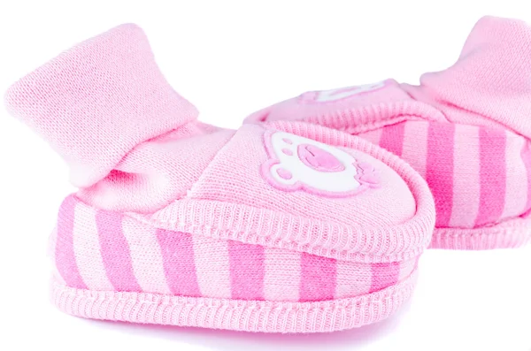 Růžové pletené dětské boty na bílém pozadí — Stock fotografie