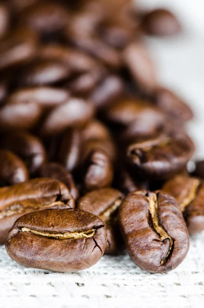 Coffee beans in a linen napkin — Stock Photo, Image