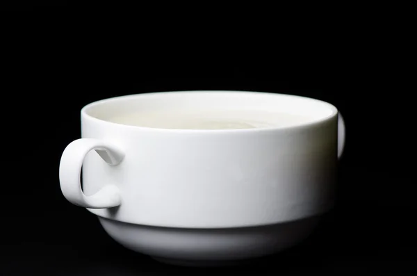 Bramborová polévka na černém pozadí — Stock fotografie