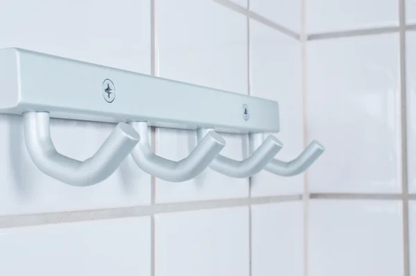 Brushed metal silver towel hanger — Stock Photo, Image