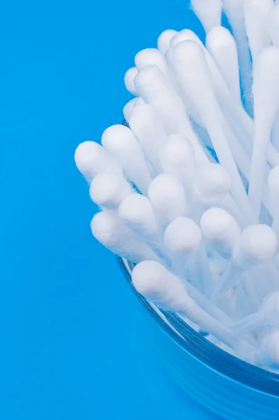 Cotton buds on blue — Stock Photo, Image