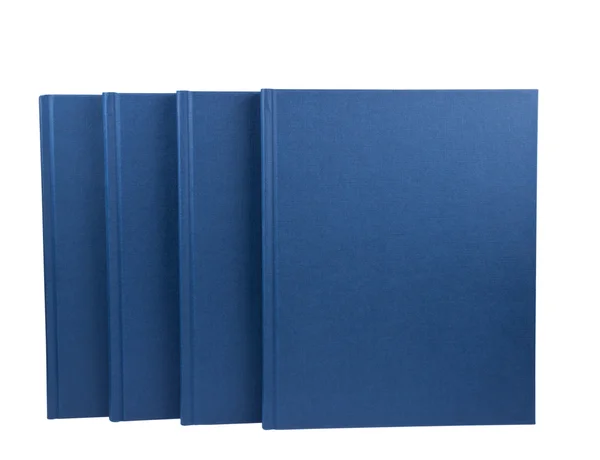 Четыре изолированных голубых блокнота — стоковое фото