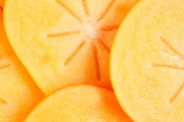 Cuted persimmon op paar stukken — Stockfoto