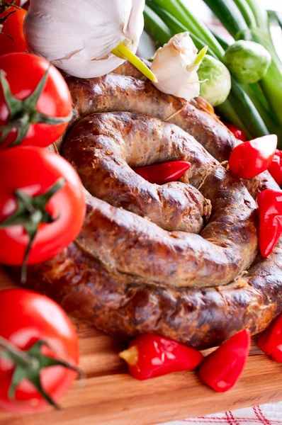 stock image Sausage with spices, tomatoes and red pepper