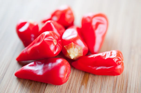 Red chili pepper on a cutting board — Stock Photo, Image