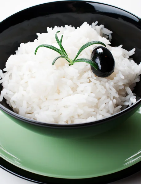 Rice in black round bowl — Stock Photo, Image