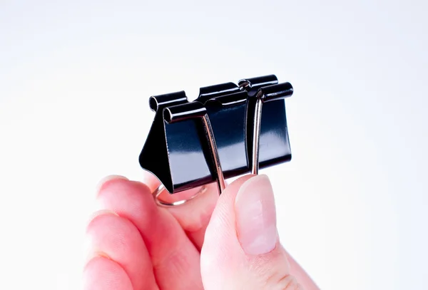 Hand holding a clip — Stock Photo, Image