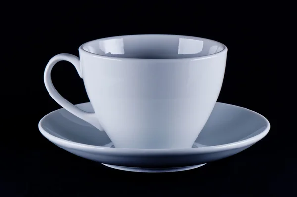 Witte cup op schotel — Stockfoto