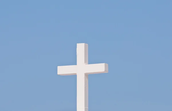 stock image White Christian cross on blue sky background