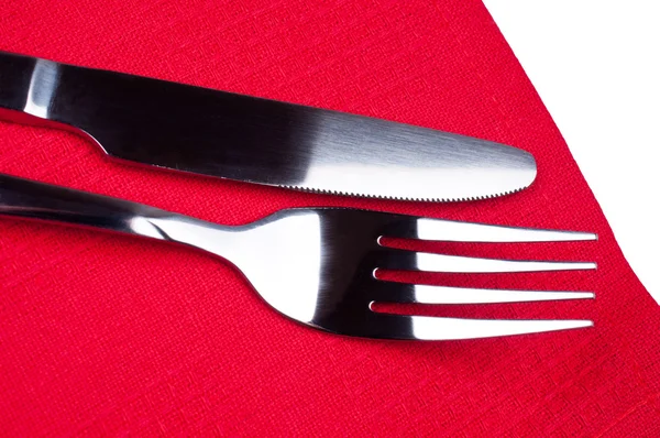 Mes en vork op rood tafellaken — Stockfoto