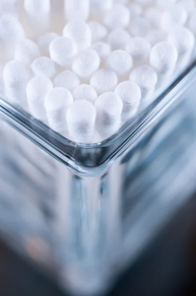 Cotton buds in a glass corner — Stock Photo, Image