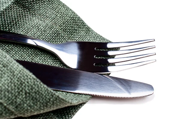 Knife and fork on green napkin — Stock Photo, Image