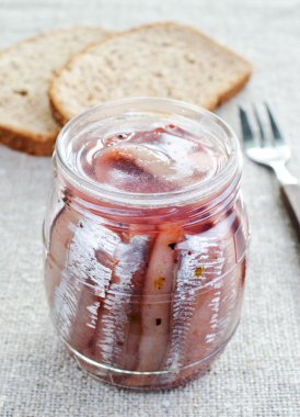 Herring in a glass jar clipart