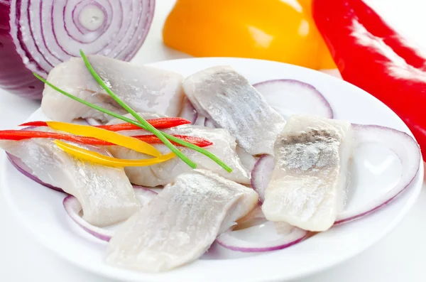 Herring bites with onion and pepper — Stock Photo, Image