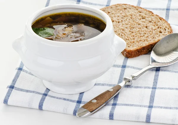 Bowl of mushroom soup with spoon and bread — Stock Photo, Image