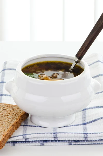 Bowl of mushroom soup with spoon — Stock Photo, Image