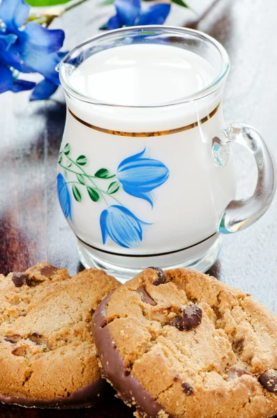 Two chocolate cookies and milk — Stock Photo, Image