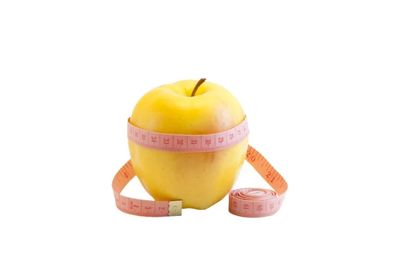 Manzana amarilla fresca y cinta métrica —  Fotos de Stock