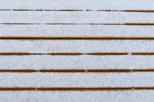 Nieve fresca en tablas de cubierta. Antecedentes de su texto . — Foto de Stock