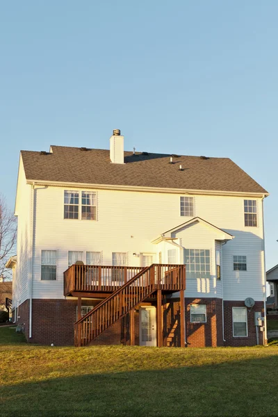 Back view of a typical american two story house with basement an — Stock Photo, Image