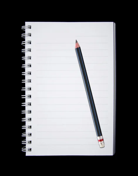 Zápisník a tužku, izolované na černém pozadí — Stock fotografie